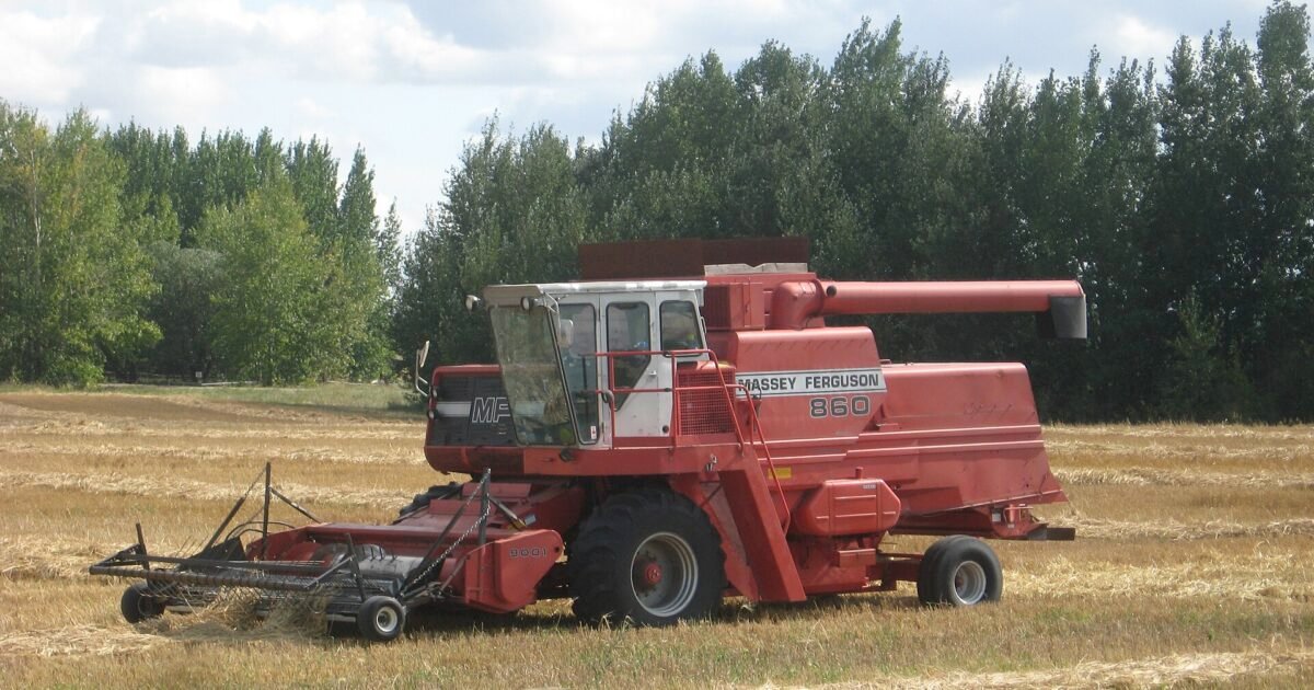 Massey-Ferguson 860 combine harvester working a grain field in rural Saskatchewan