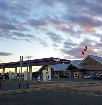 Semi-truck parked at a highway truck stop, illustrating detention and layover wait time